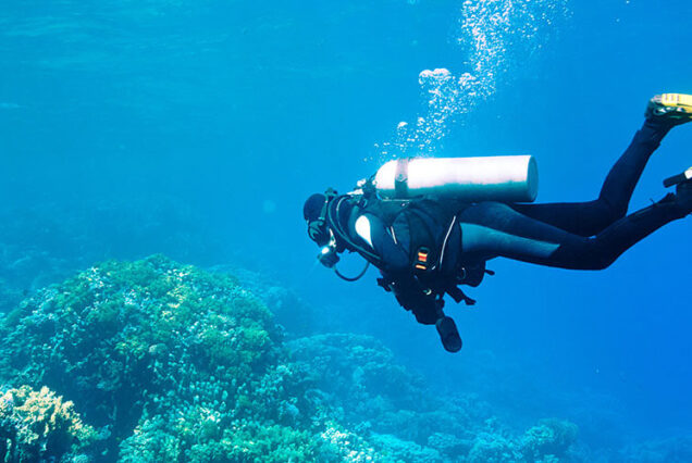 Beginner scuba diver in Hurghada Red Sea – learning to dive with instructor